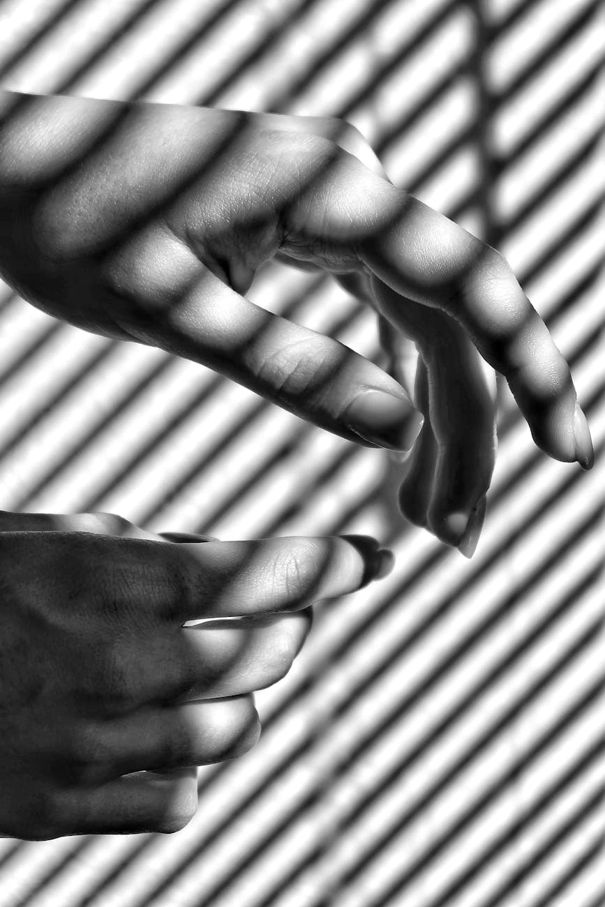 grayscale photo of persons hand