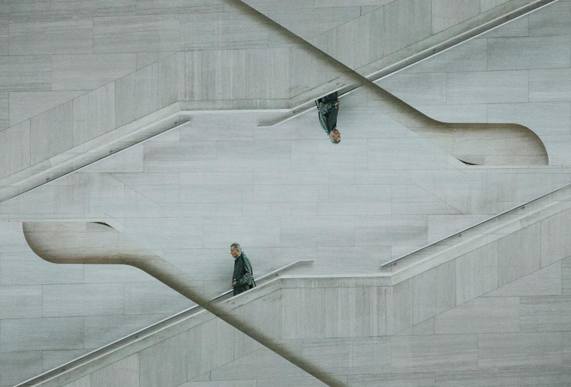 optical illusion photo of man on stairs